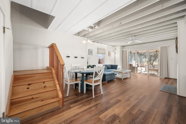 living room with ceiling fan with notable chandelier and wood-type flooring