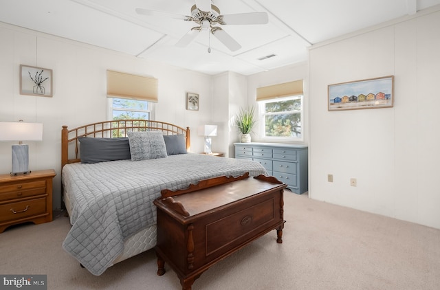 bedroom featuring ceiling fan and light carpet