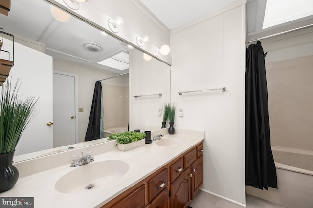 bathroom with shower / bath combo and vanity