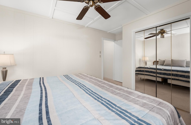 bedroom featuring ceiling fan and a closet