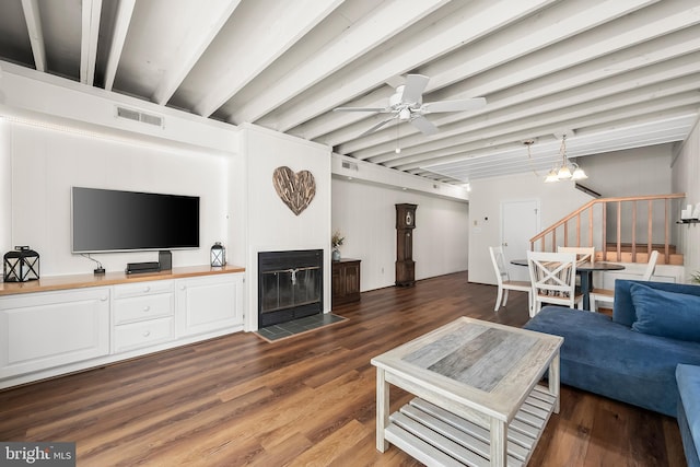 living room featuring ceiling fan, dark hardwood / wood-style floors, and beam ceiling