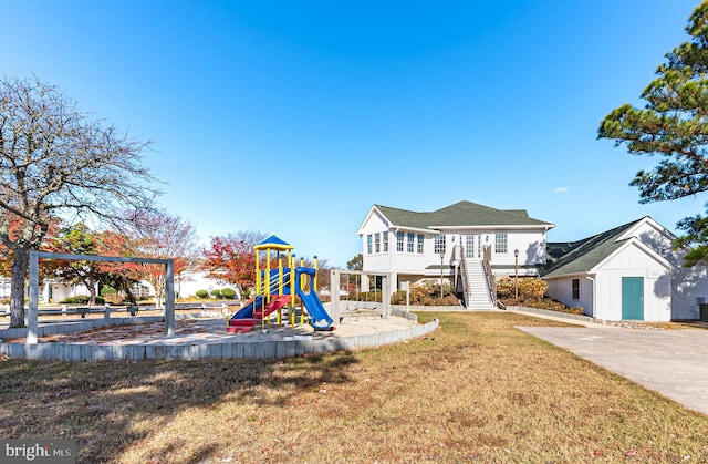 view of jungle gym with a lawn