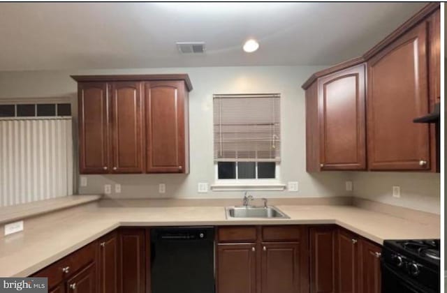 kitchen featuring sink and black appliances