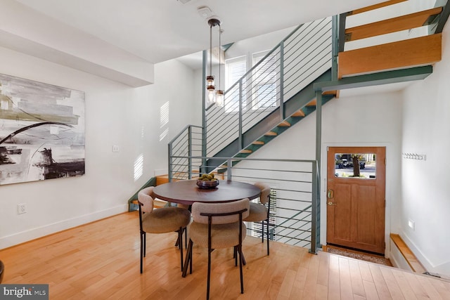 dining area featuring light wood-type flooring