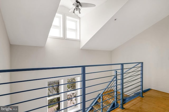 interior space featuring hardwood / wood-style flooring, plenty of natural light, and vaulted ceiling