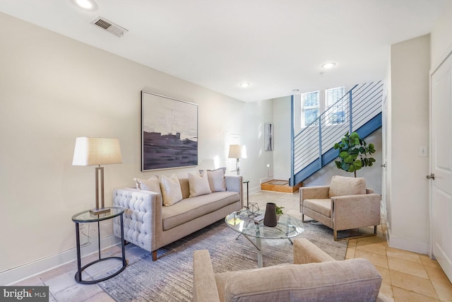 living room with light tile patterned floors