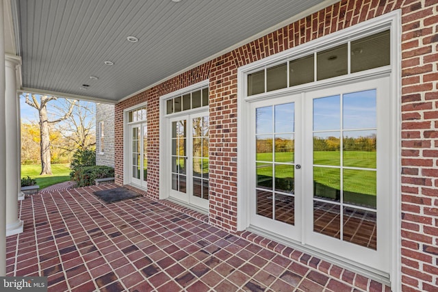 view of patio / terrace featuring a porch and french doors