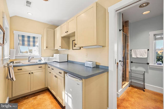 kitchen featuring sink and cream cabinets