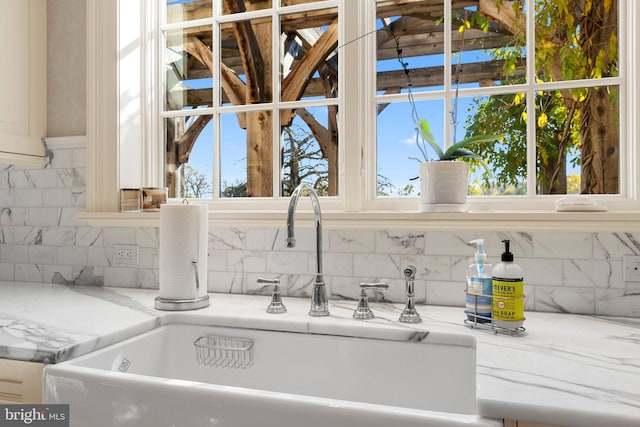 room details with light stone counters and sink