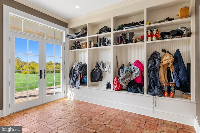 mudroom featuring crown molding and french doors