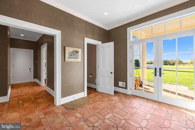 foyer with french doors and crown molding