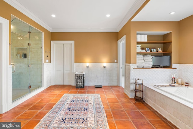 bathroom with tile patterned flooring, built in shelves, independent shower and bath, and crown molding