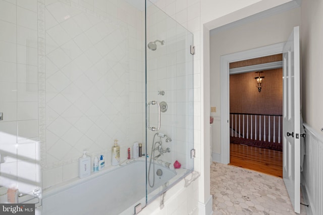 bathroom featuring tile patterned floors and bath / shower combo with glass door