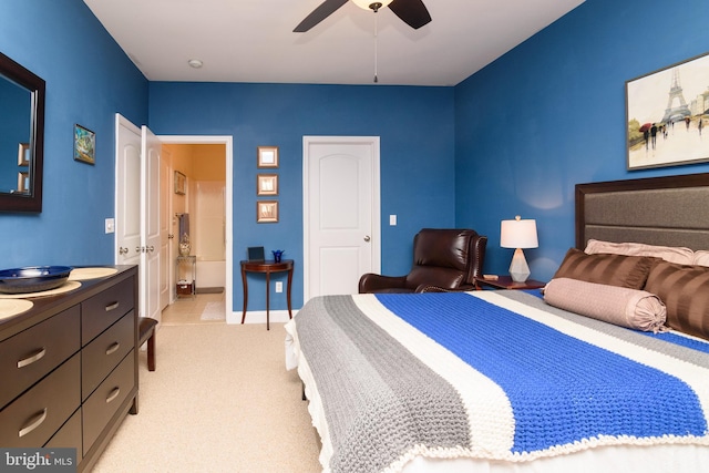 carpeted bedroom featuring ceiling fan and connected bathroom