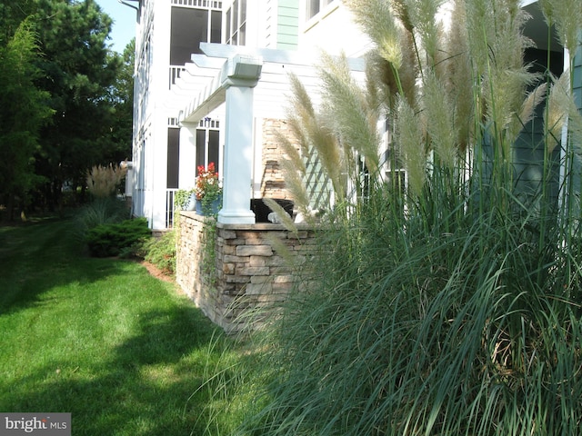 view of home's exterior featuring a lawn