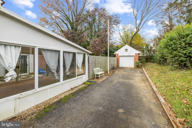 view of home's exterior featuring a garage and an outdoor structure