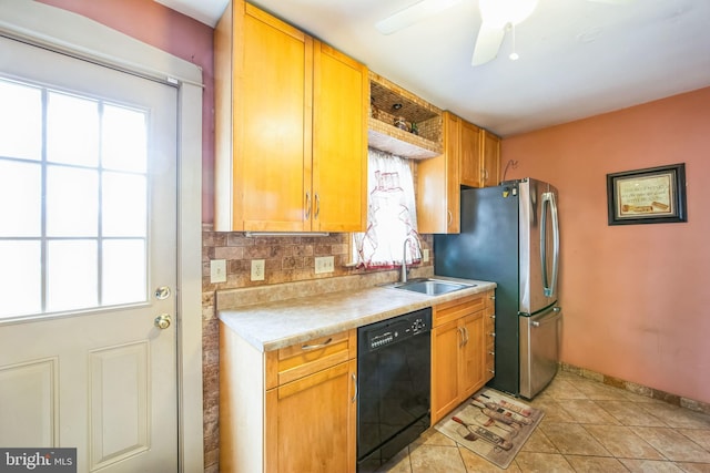 kitchen featuring black dishwasher, decorative backsplash, sink, light tile patterned flooring, and ceiling fan