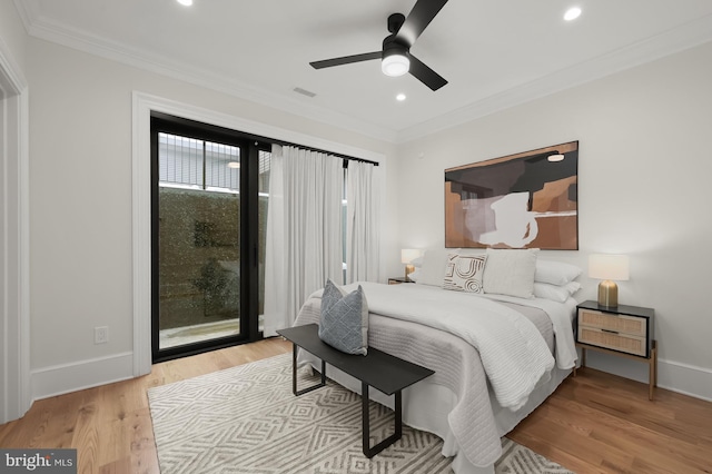 bedroom featuring ceiling fan, access to exterior, ornamental molding, and light hardwood / wood-style floors