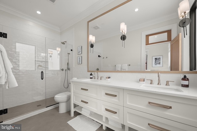 bathroom featuring a shower with shower door, toilet, vanity, and ornamental molding