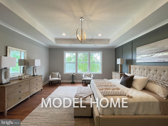 bedroom with a notable chandelier, a raised ceiling, ornamental molding, and dark hardwood / wood-style flooring