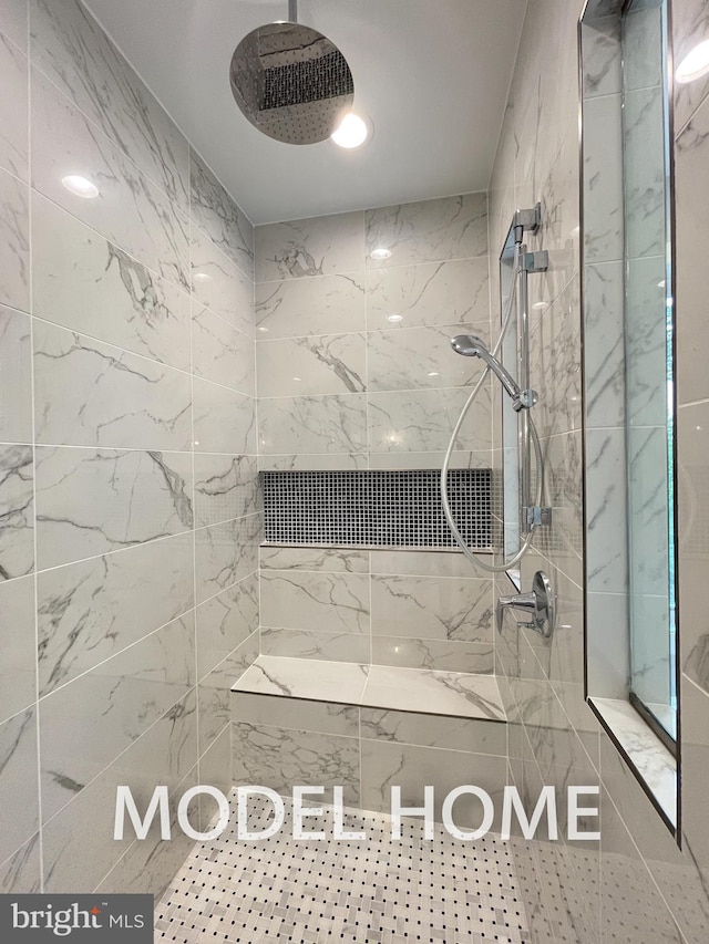 bathroom featuring a tile shower