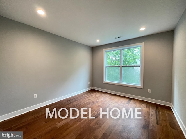 empty room featuring hardwood / wood-style floors