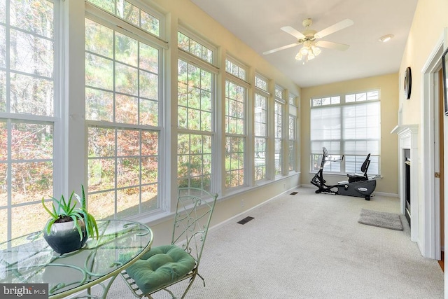 sunroom with ceiling fan