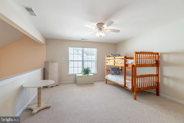 bedroom featuring ceiling fan and carpet