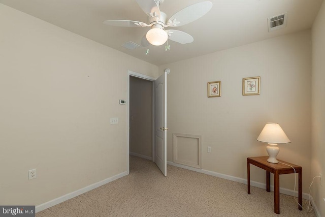 unfurnished bedroom with ceiling fan and light colored carpet