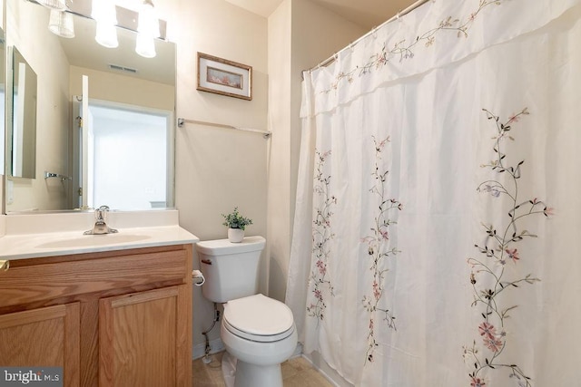 bathroom featuring vanity, tile patterned floors, toilet, and a shower with shower curtain