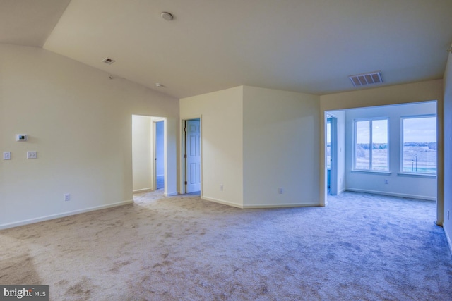 5003 E Pebble Ln Unit J, Milford, DE 19963 - carpeted spare room featuring baseboards and lofted ceiling