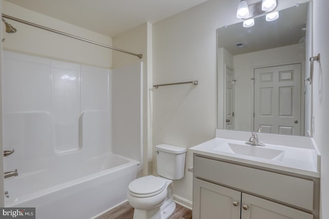 5003 E Pebble Ln Unit J, Milford, DE 19963 - bathroom featuring wood finished floors, toilet, vanity, and shower / bath combination