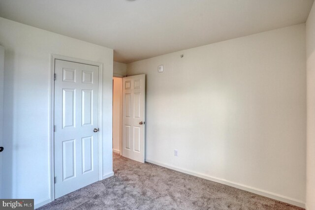 unfurnished bedroom with light carpet