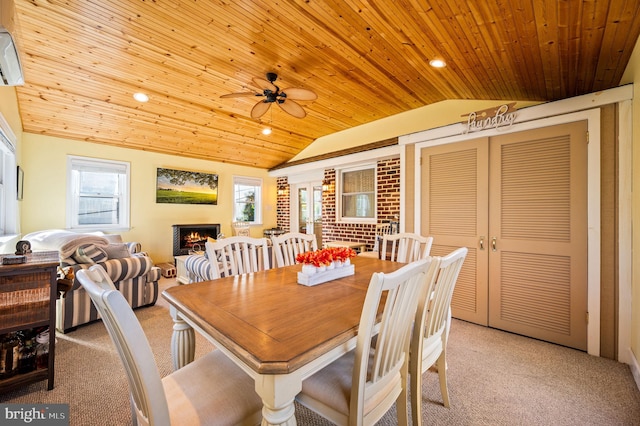 dining area with light carpet and vaulted ceiling