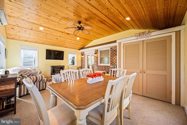 carpeted dining area with lofted ceiling, wood ceiling, and plenty of natural light