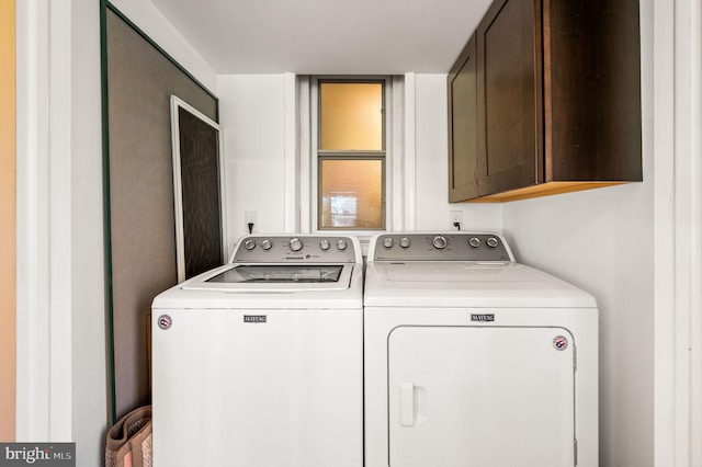 laundry room featuring cabinets and independent washer and dryer