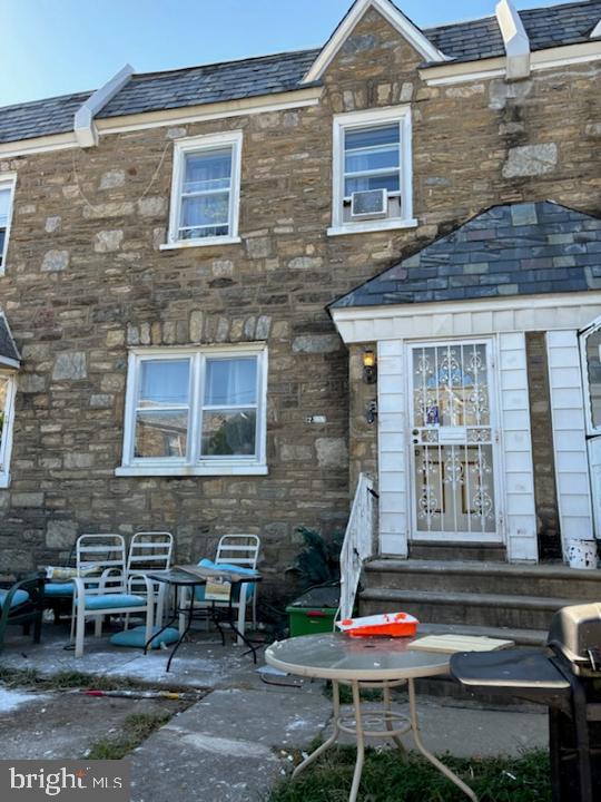 back of house with a patio and cooling unit