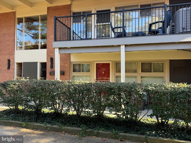 3411 University Blvd W Unit 204, Kensington, MD 20895 - entrance to property featuring brick siding and a balcony