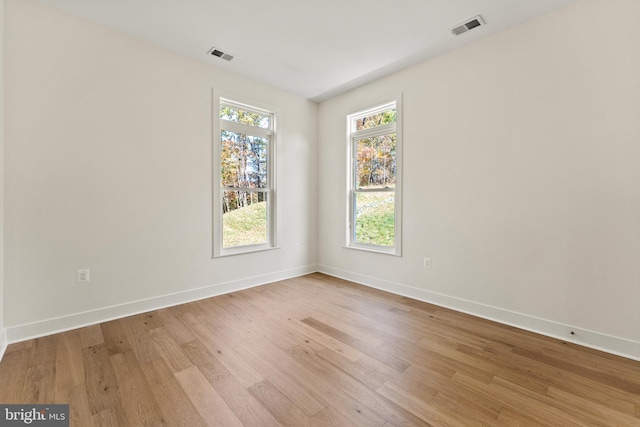 unfurnished room featuring light hardwood / wood-style flooring