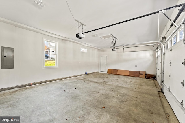 garage featuring a garage door opener and electric panel