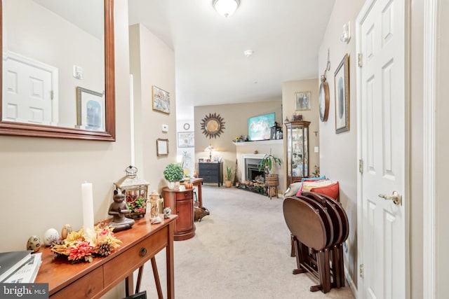 hallway with light colored carpet