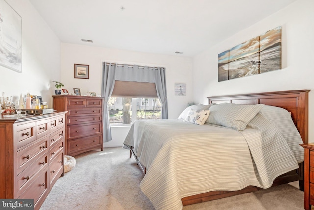 bedroom featuring light colored carpet