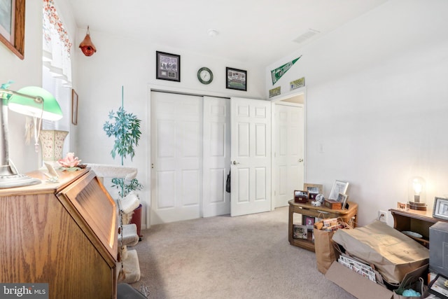 sitting room featuring light colored carpet