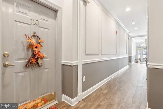 hallway featuring french doors and light wood-type flooring