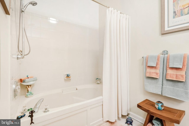 bathroom with shower / bath combo