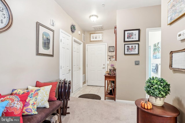 view of carpeted entrance foyer