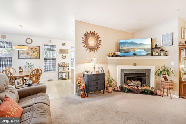 carpeted living room featuring plenty of natural light