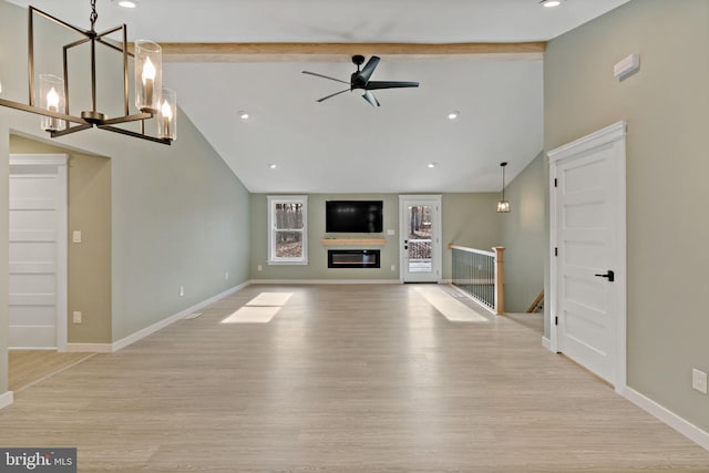 unfurnished living room with beam ceiling, high vaulted ceiling, ceiling fan with notable chandelier, and light wood-type flooring