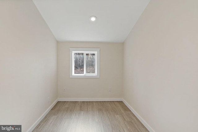 spare room featuring light wood-type flooring