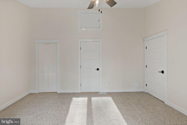 carpeted empty room with ceiling fan